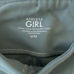 Athleta girls tights. 2 pair. Excellent condition. Green pair has pockets.
